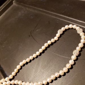 Pearl necklace with 3 diamond beads on necklace